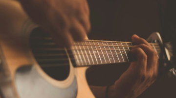 person-playing-guitar.jpg person playing guitar